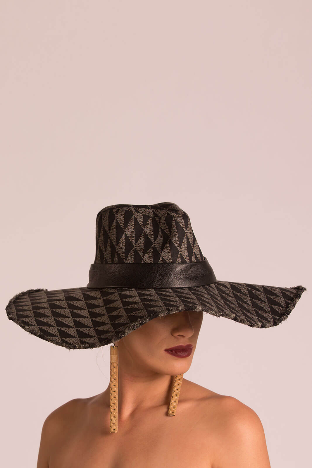 Female model wearing a black hat