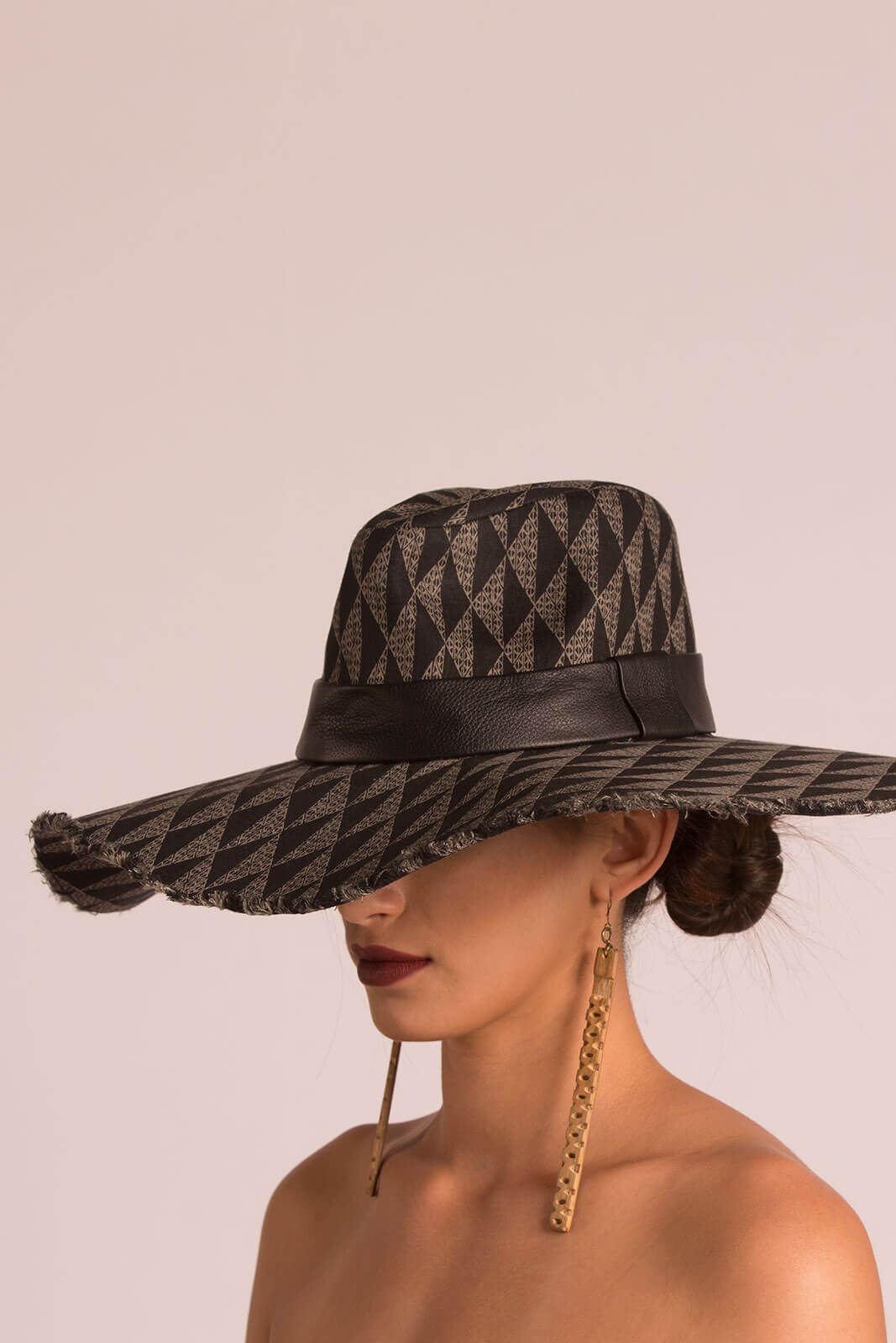 Female model wearing a black hat
