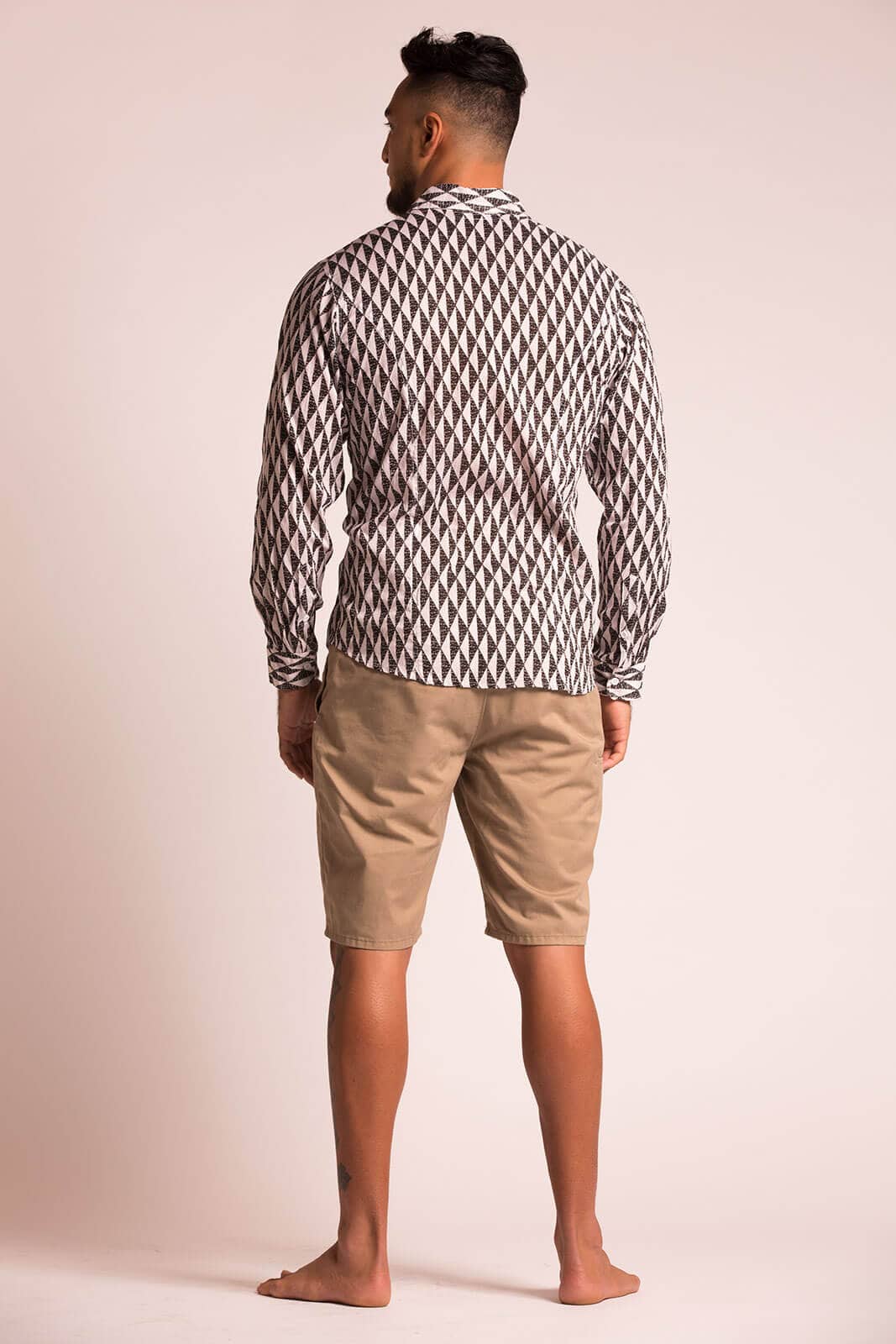 Male model wearing Hilo L-S in Mauna Pattern and Black and White Color - Back View