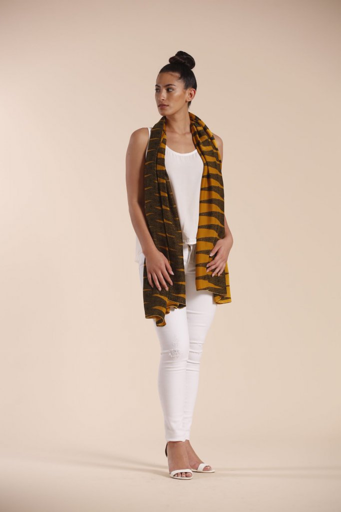 Female model wearing a mustard scarf