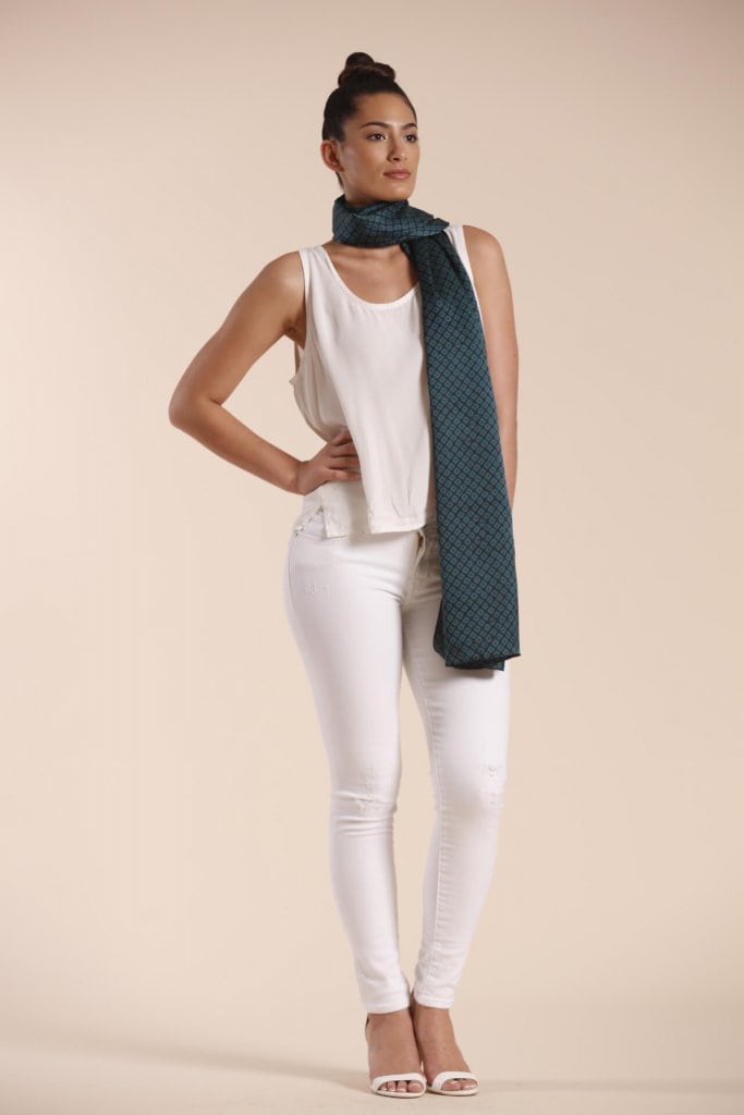 Female model wearing a dark green scarf