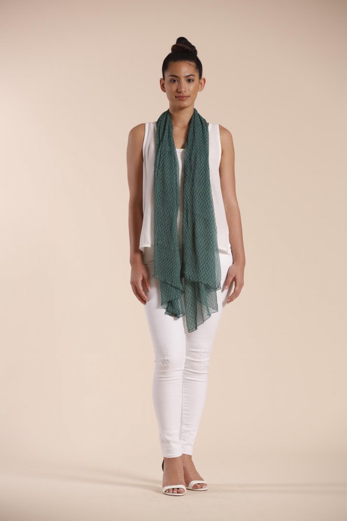 Female model wearing a dark green scarf