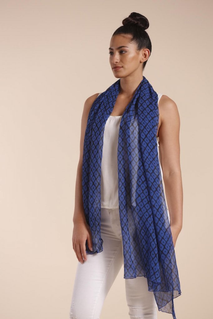 Female model wearing a blue scarf