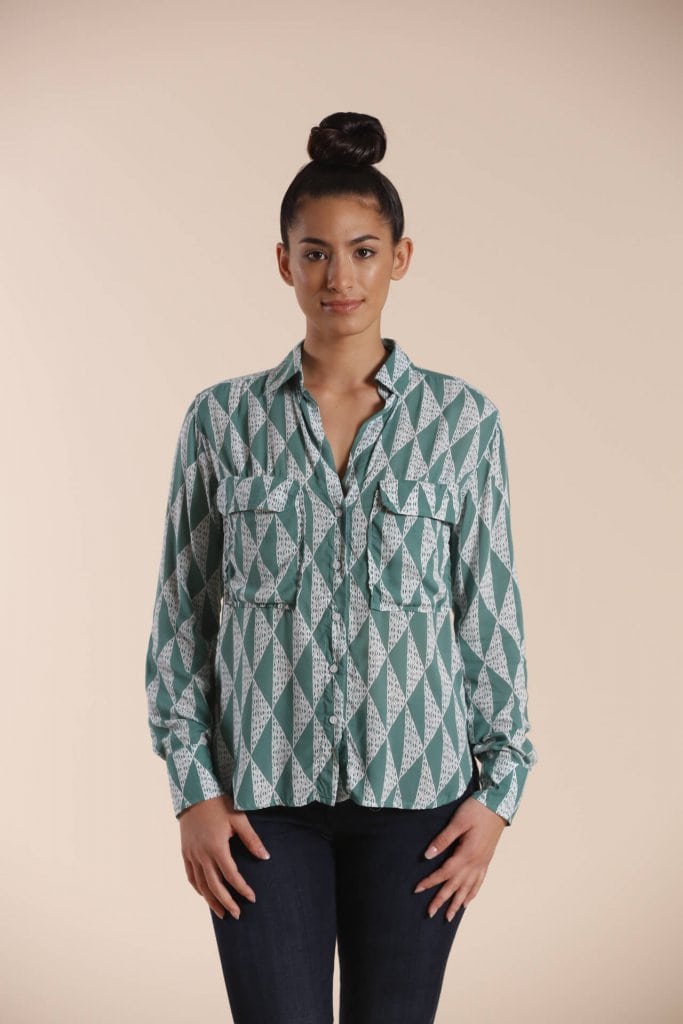 Female model wearing a Long Sleeve Button Shirt in sage green - Front View