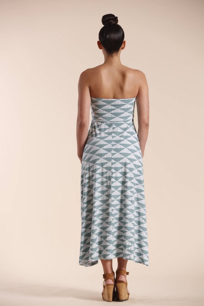 Female model wearing a strapless dress in sage green - Back View
