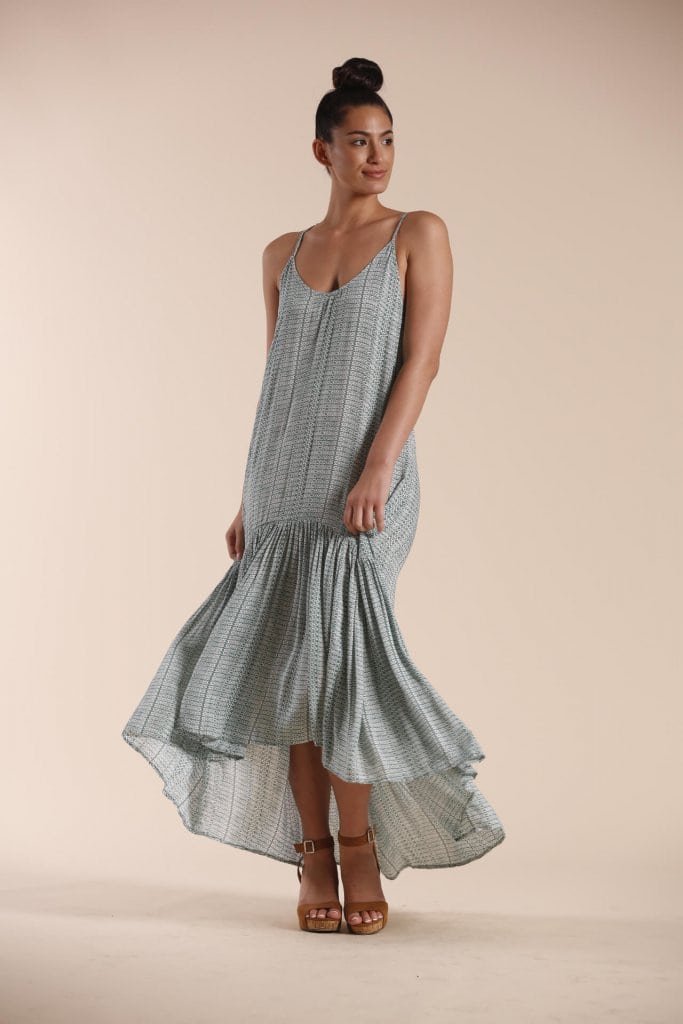 Female model wearing a Spaghetti Strap Hi Low Dress in sage green - Front View