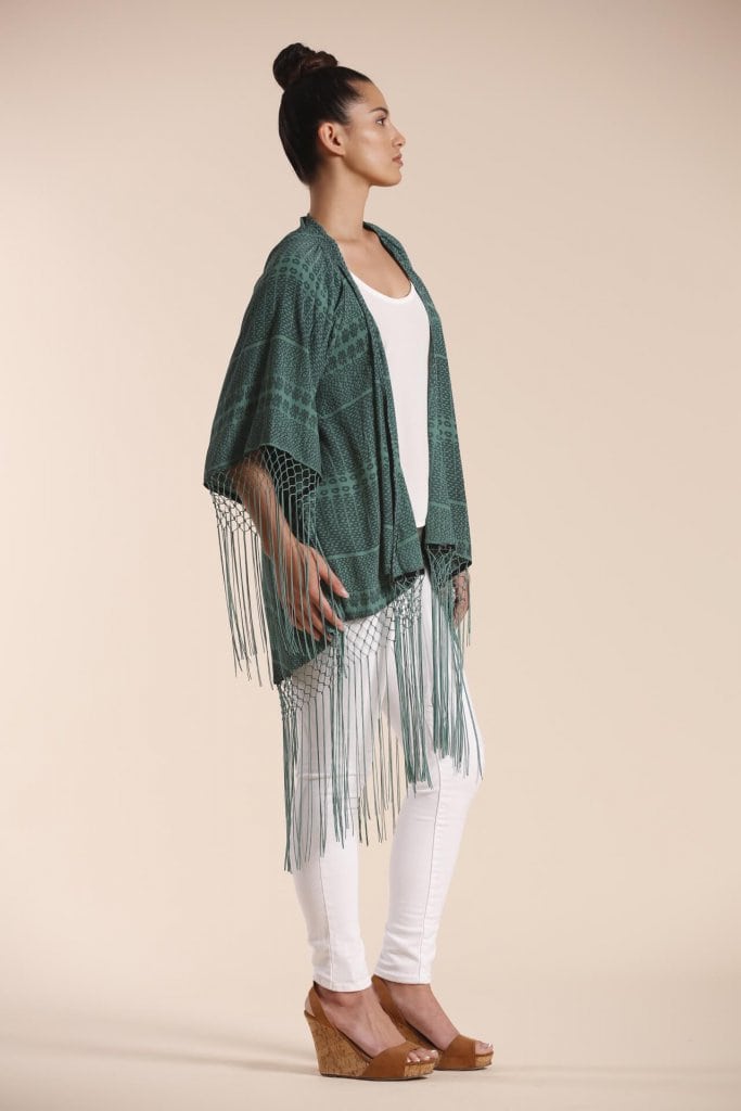 Female model wearing a Shawl in dark green - Side View