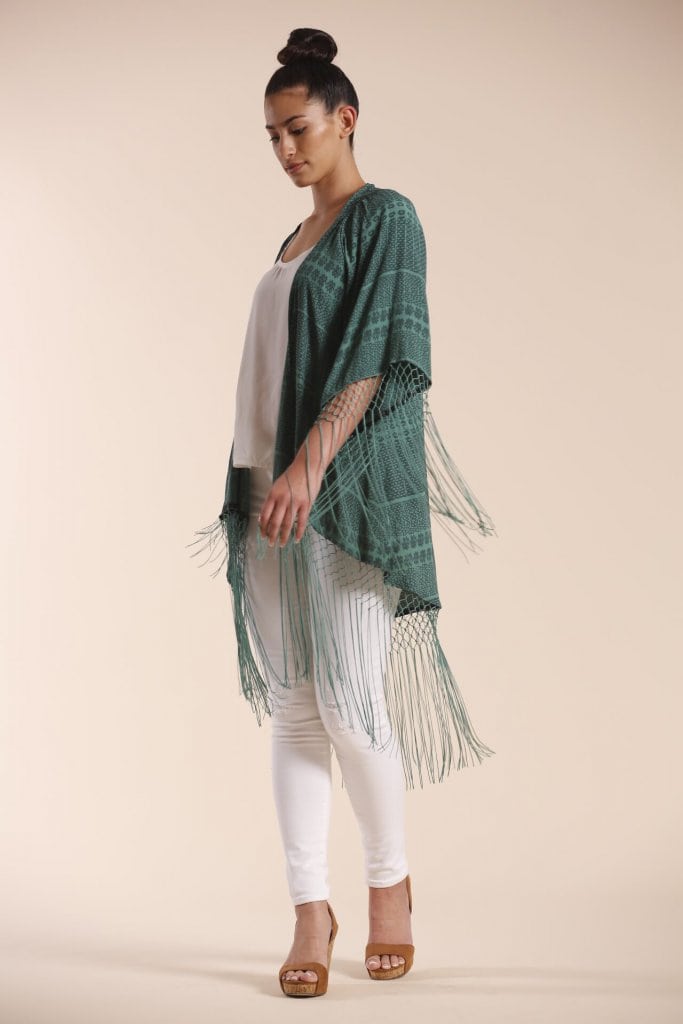 Female model wearing a Shawl in dark green - Side View