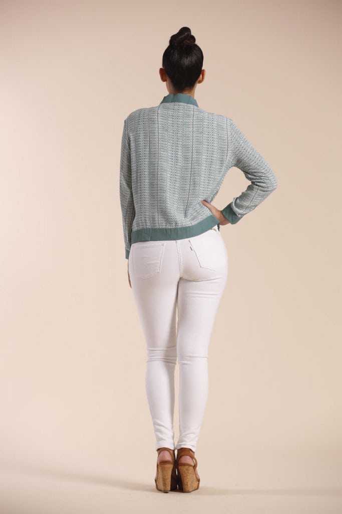 Female model wearing a Jacket in Light Green - Back View