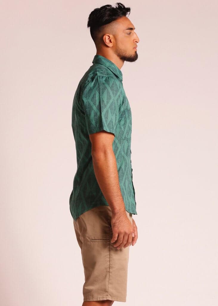 Male Model wearing Short Sleeve Button Up Shirt in Dark Green - Side View