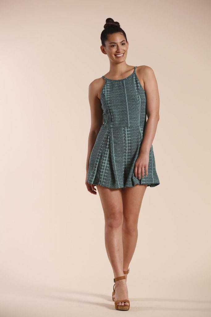 Female model wearing a Short Romper in Dark Green - Front View