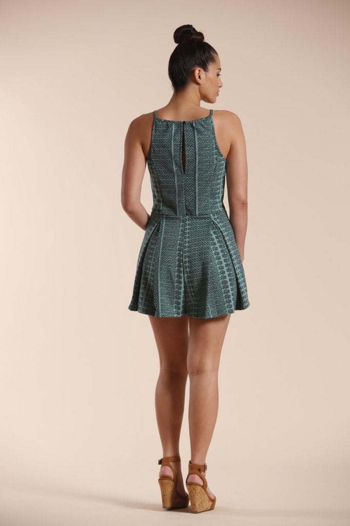 Female model wearing a Short Romper in Dark Green - Back View