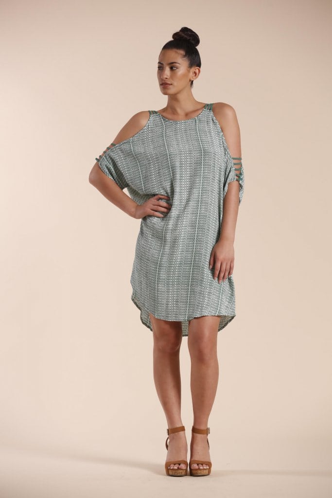 Female model wearing a sleeveless dress in sage green - Front View