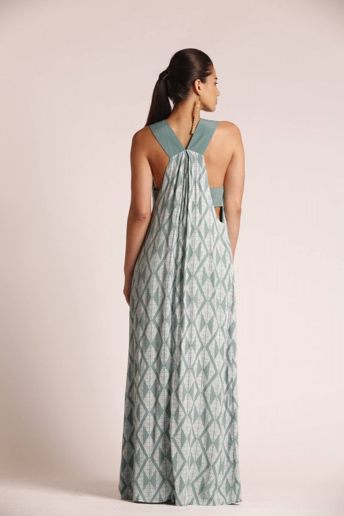 Female model wearing a Sleeveless Maxi Dress in sage green - Back View