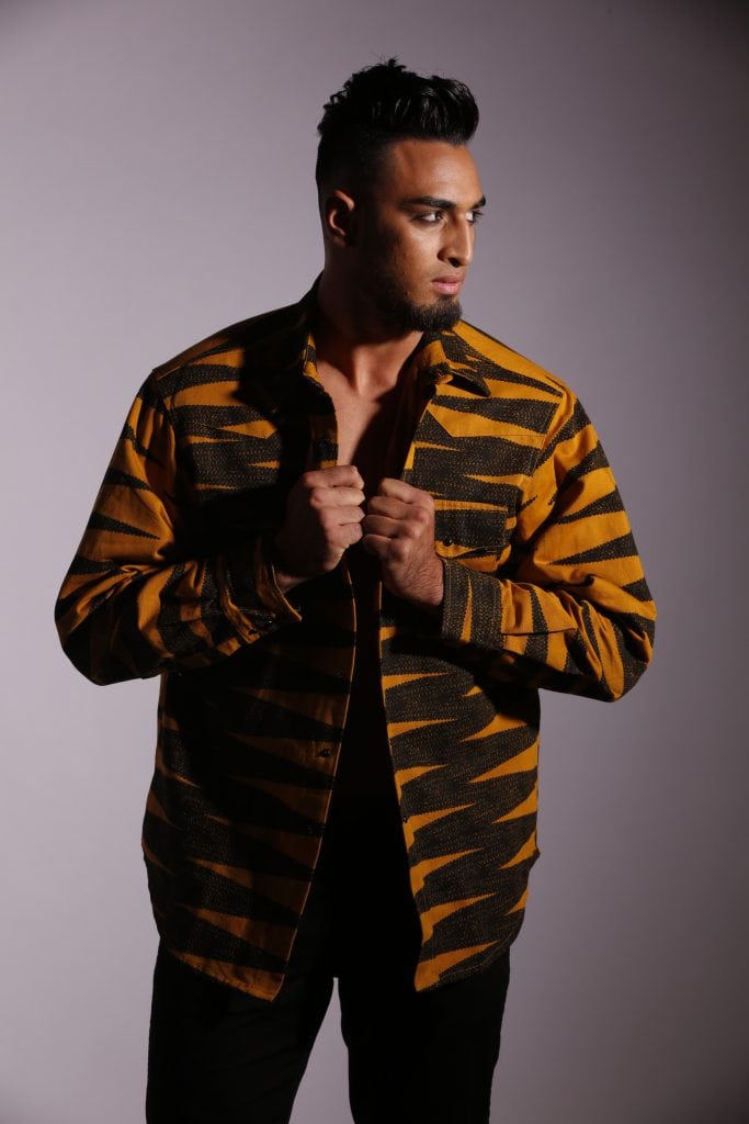 Male model wearing burnt orange jacket