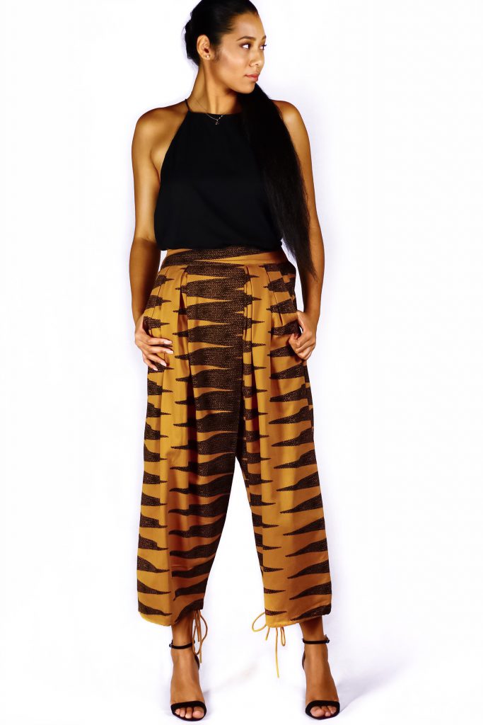 Model wearing Manaola Pants in Mustard Color - Front View