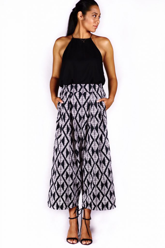 Female model wearing black and white pants - Front View