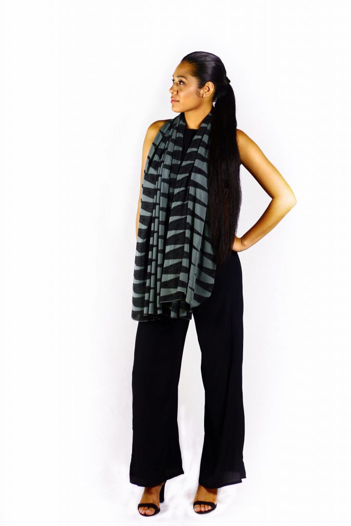 Female model wearing a black and grey scarf