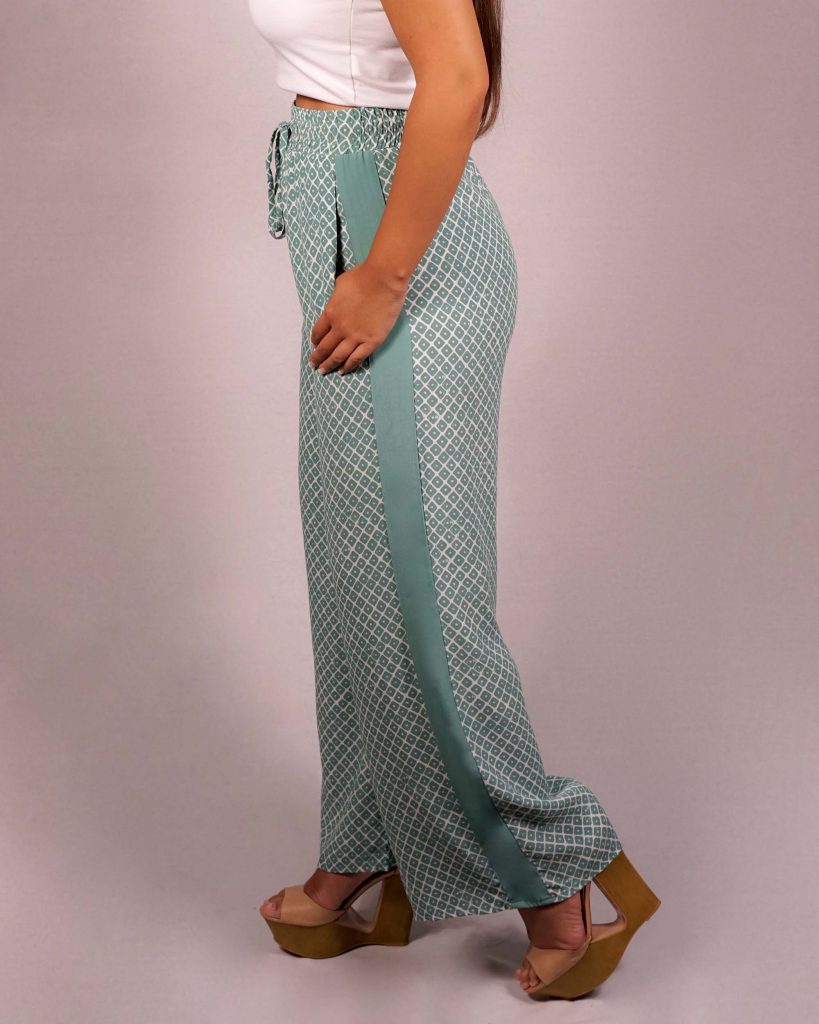 Female model wearing Wide Pants in Teal - Side View