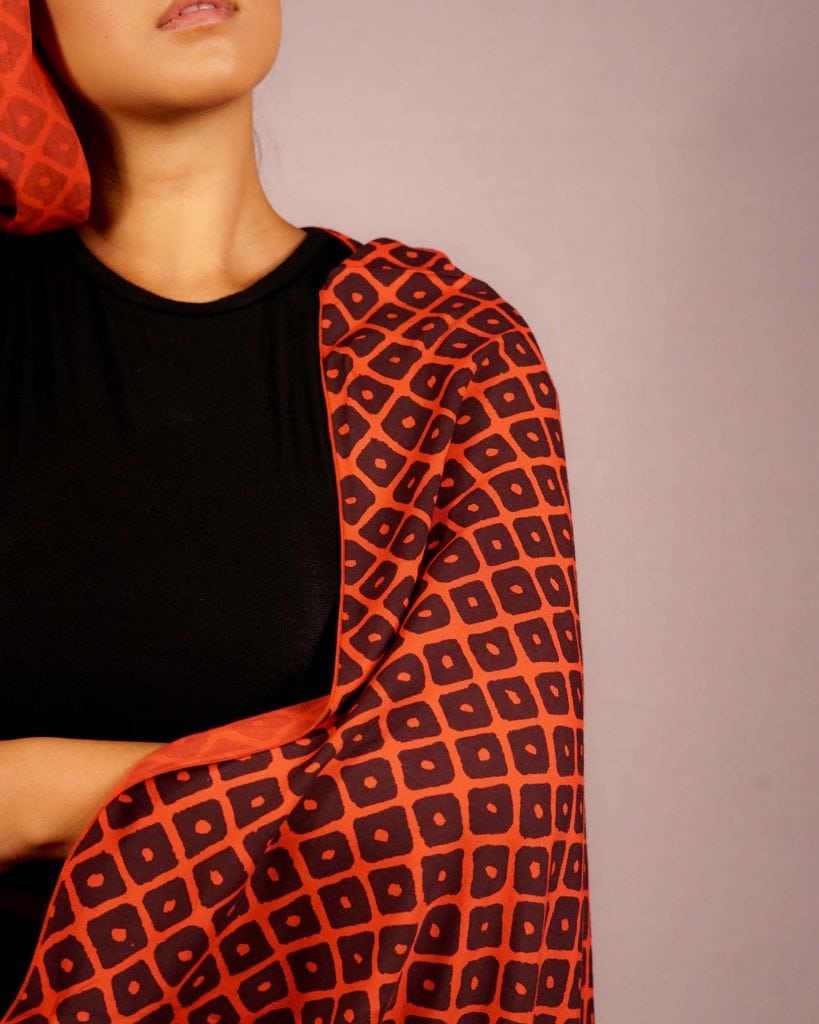 Female model wearing Red and Black Shawl