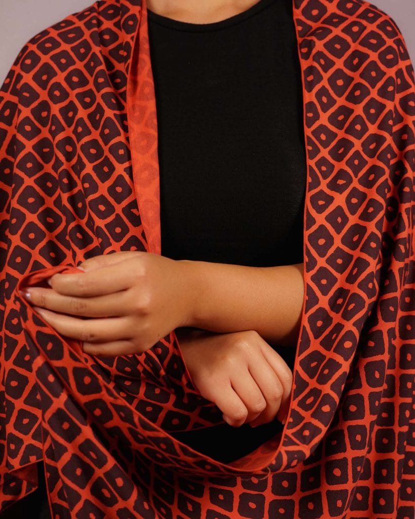 Female model wearing Red and Black Shawl