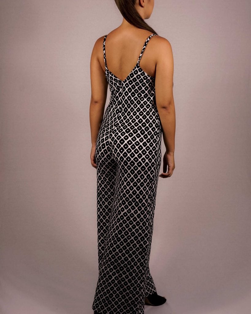 Female model waring Jumpsuit in Black/White - Back View