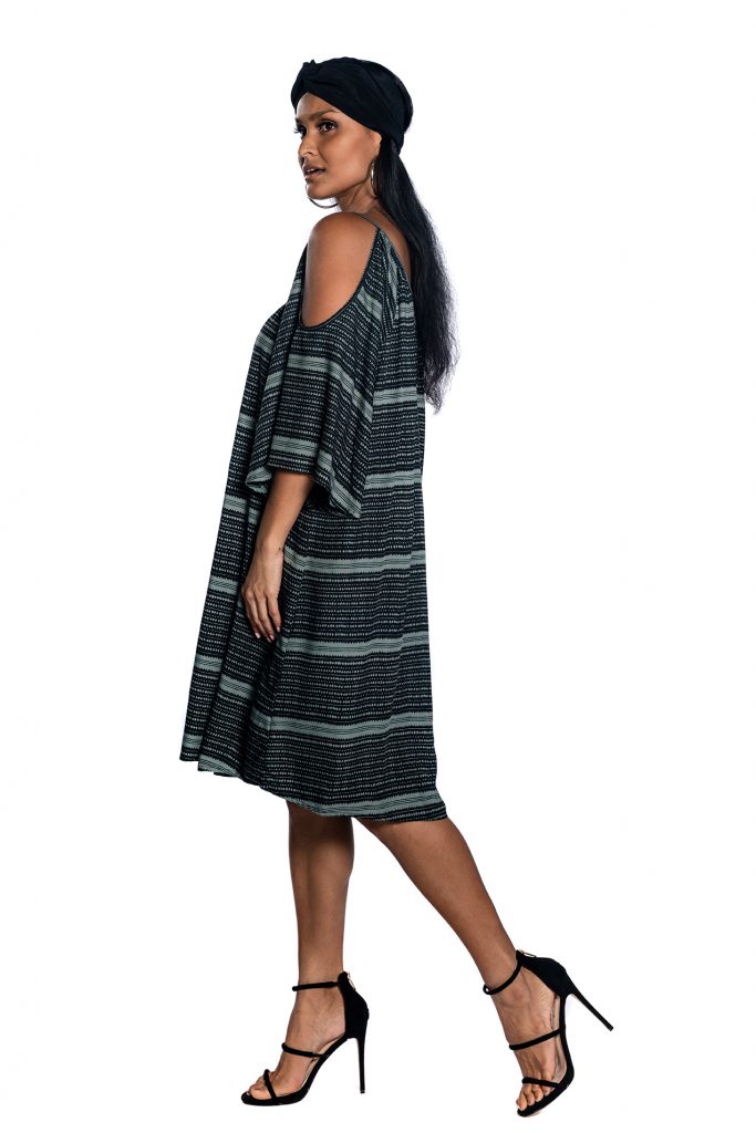 Female model wearing Black and Grey Dress - Side View