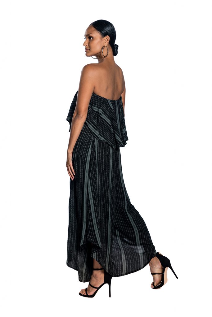 Female model wearing Strapless Jumpsuit in Black/Grey - Side View