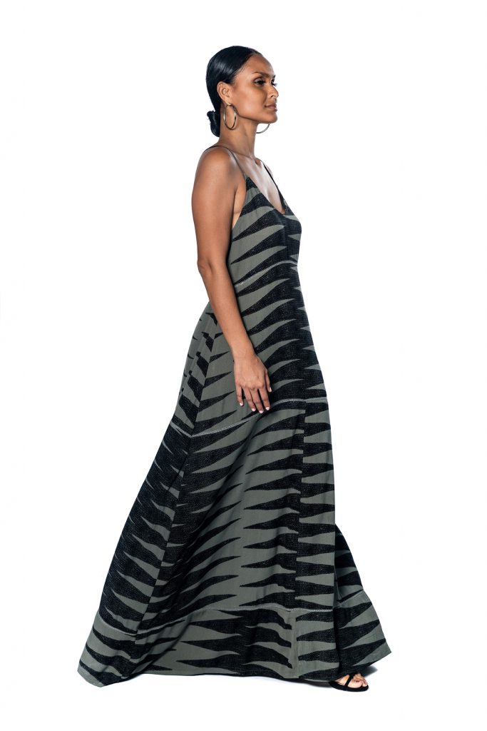 Female model wearing Maxi Dress in Grey and Black - Side View