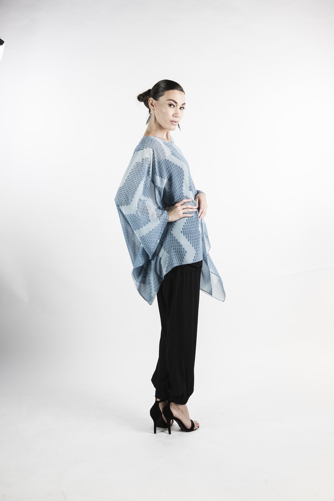 Female model wearing Kaftan in Icy Blue - Side View