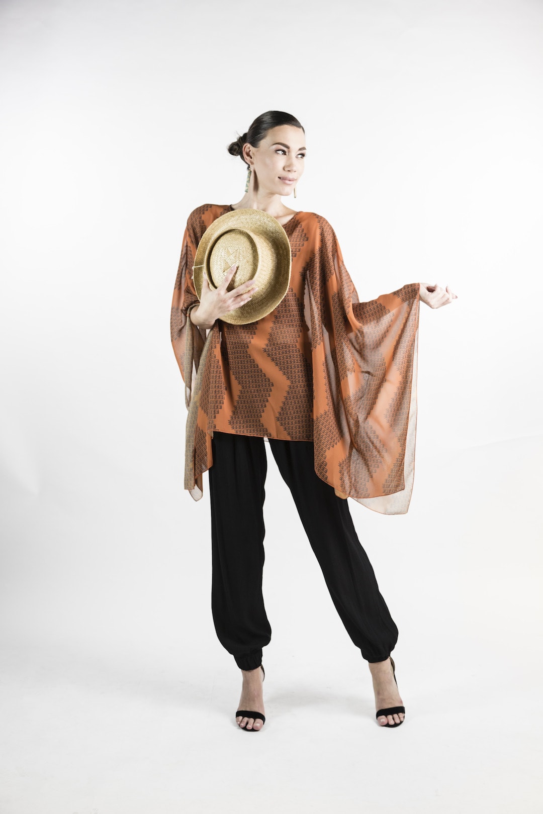 Female model wearing Kaftan in Rust - Front View