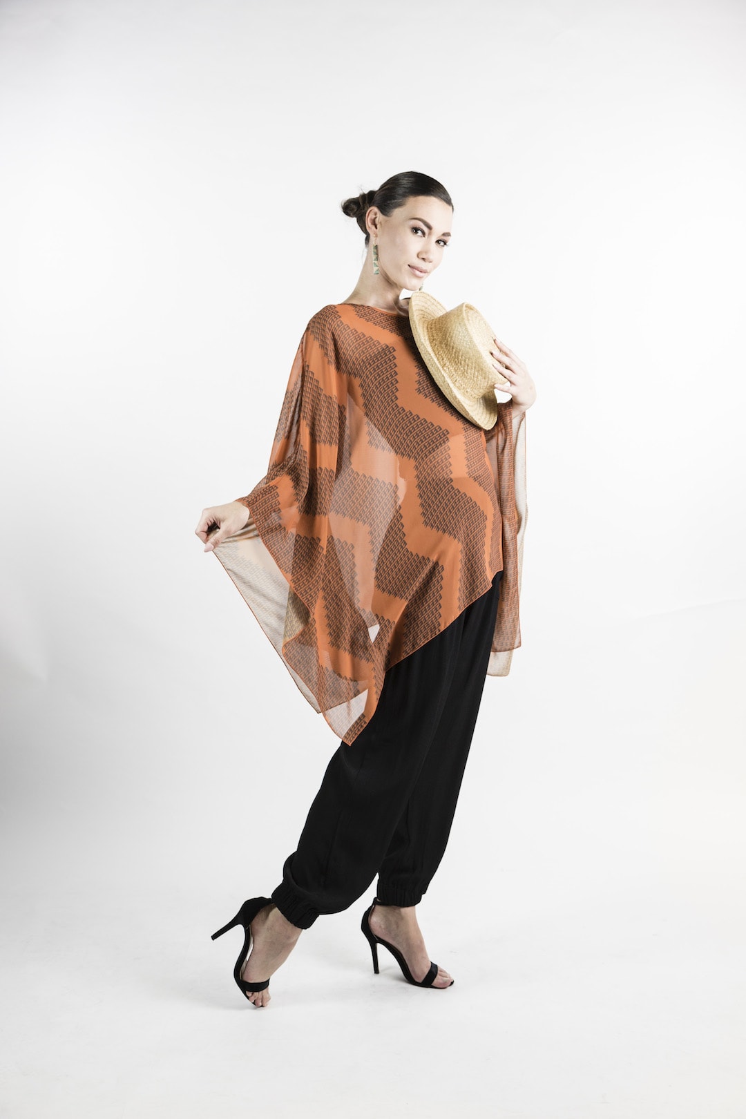 Female model wearing Kaftan in Rust - Side View