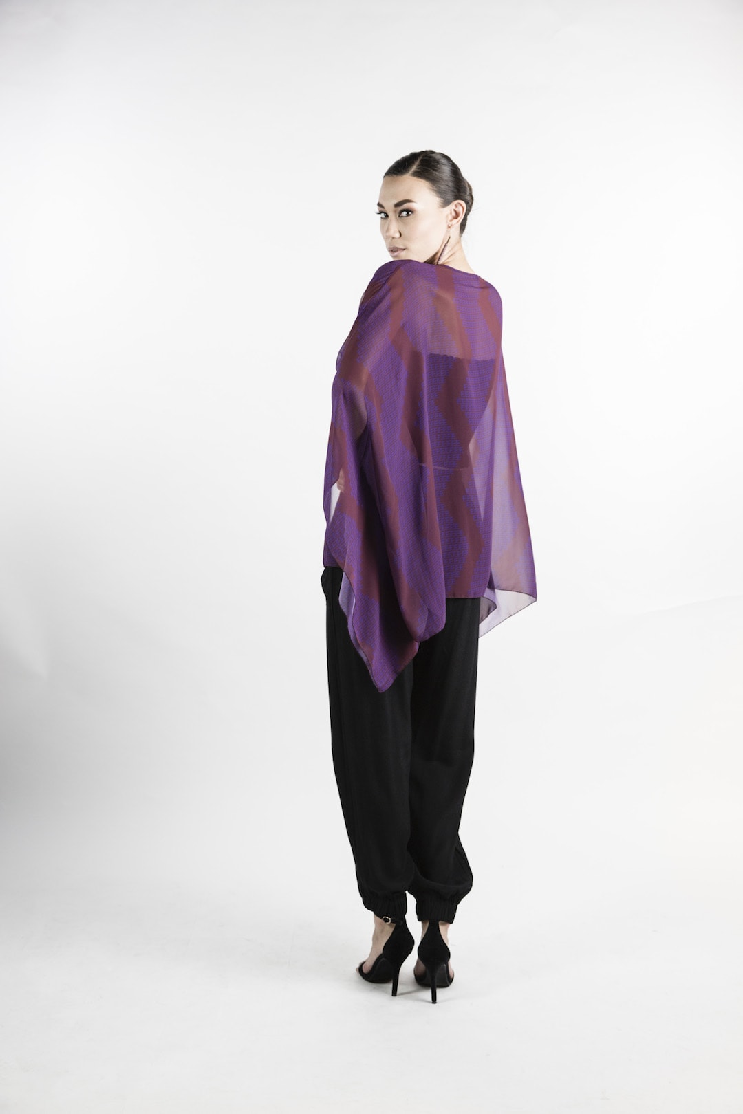 Female model wearing Kaftan in Purple - Back View