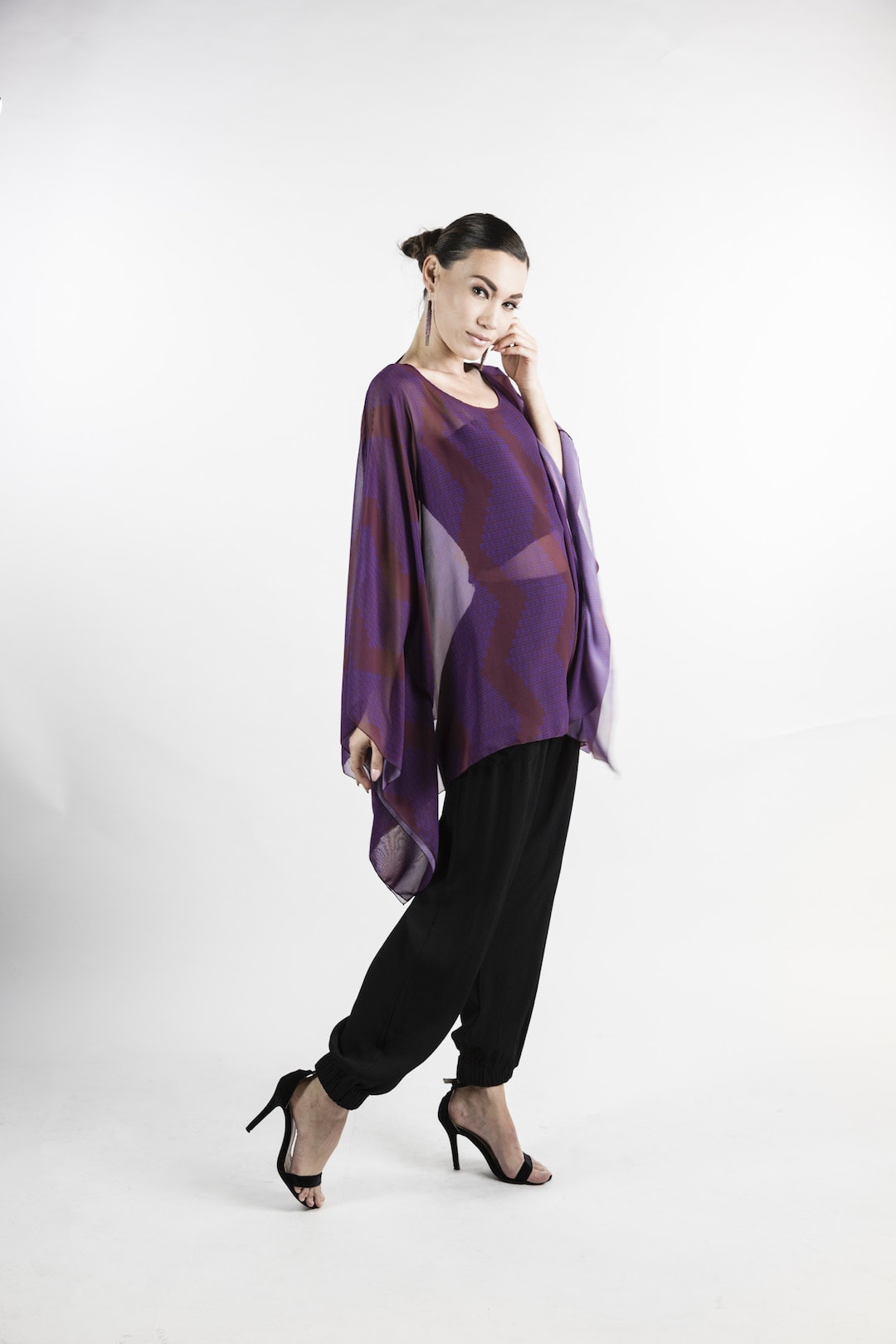 Female model wearing Kaftan in Purple - Side View
