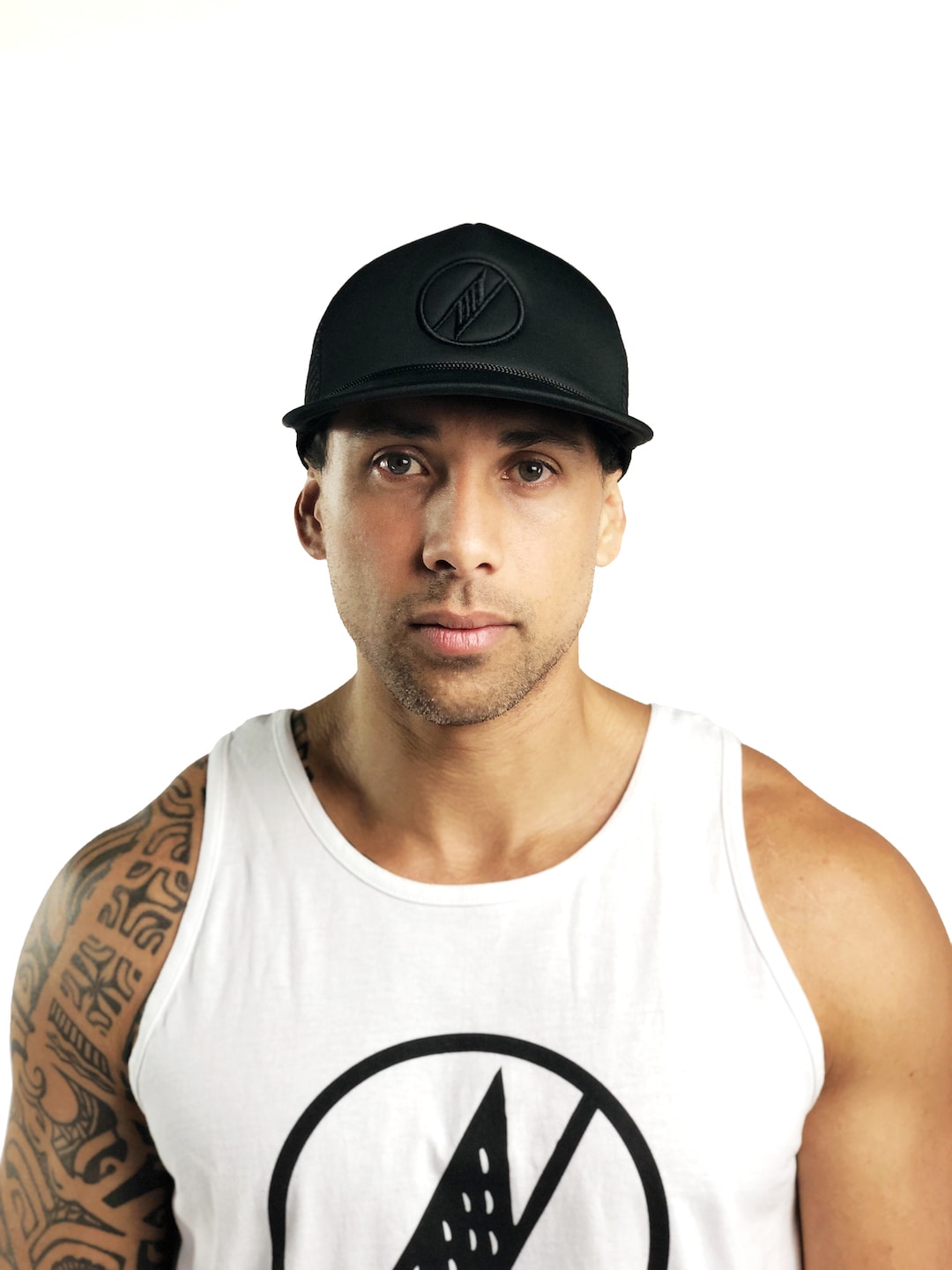 Male model wearing Logo Trucker Hat in Black - Front View