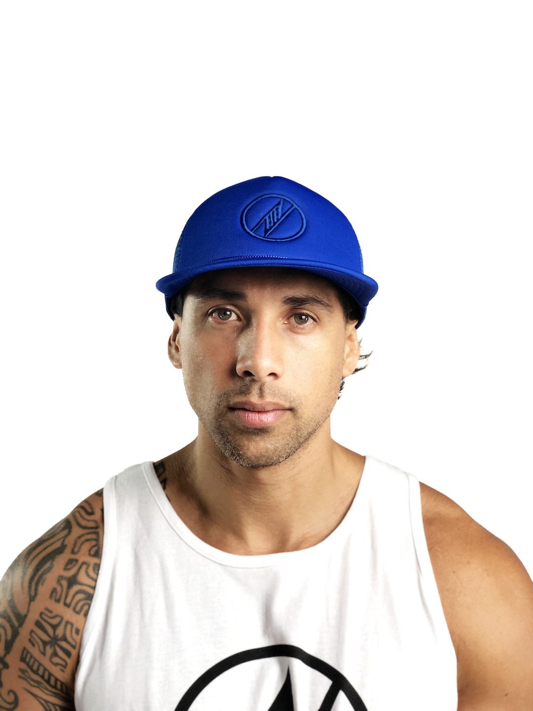 Male model wearing Logo Trucker Hat in Blue - Front View