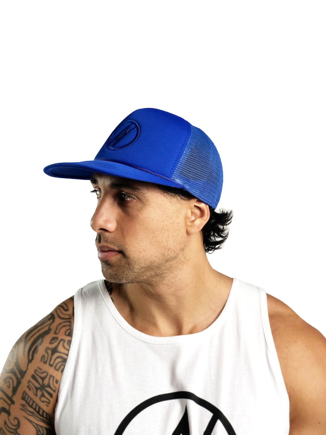 Male model wearing Logo Trucker Hat in Blue - Side View