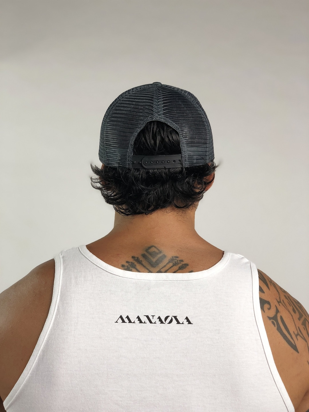 Male model wearing Logo Trucker Hat in Grey - Back View