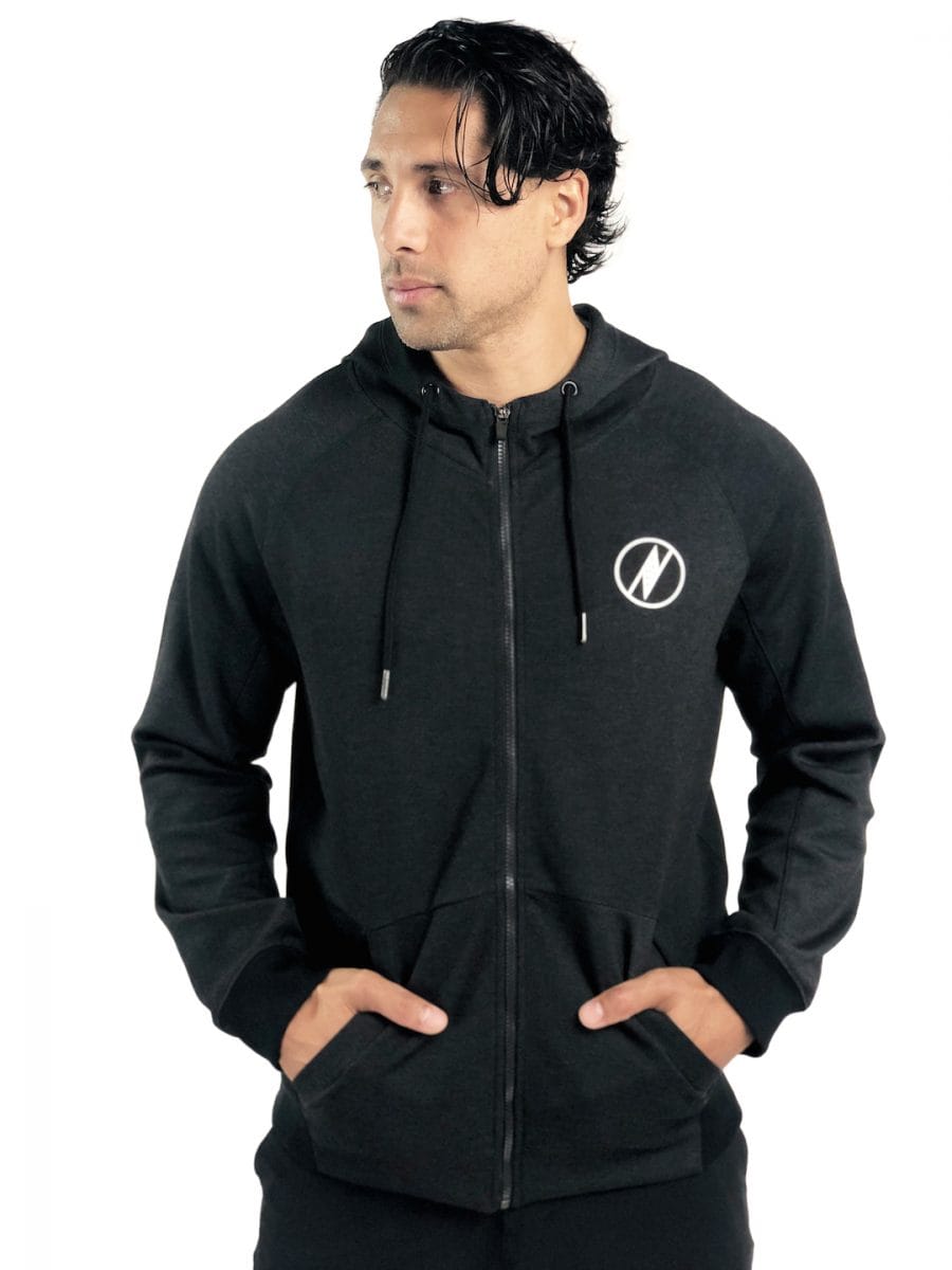 Male model wearing a Uwila Logo Jacket in Black - Front View