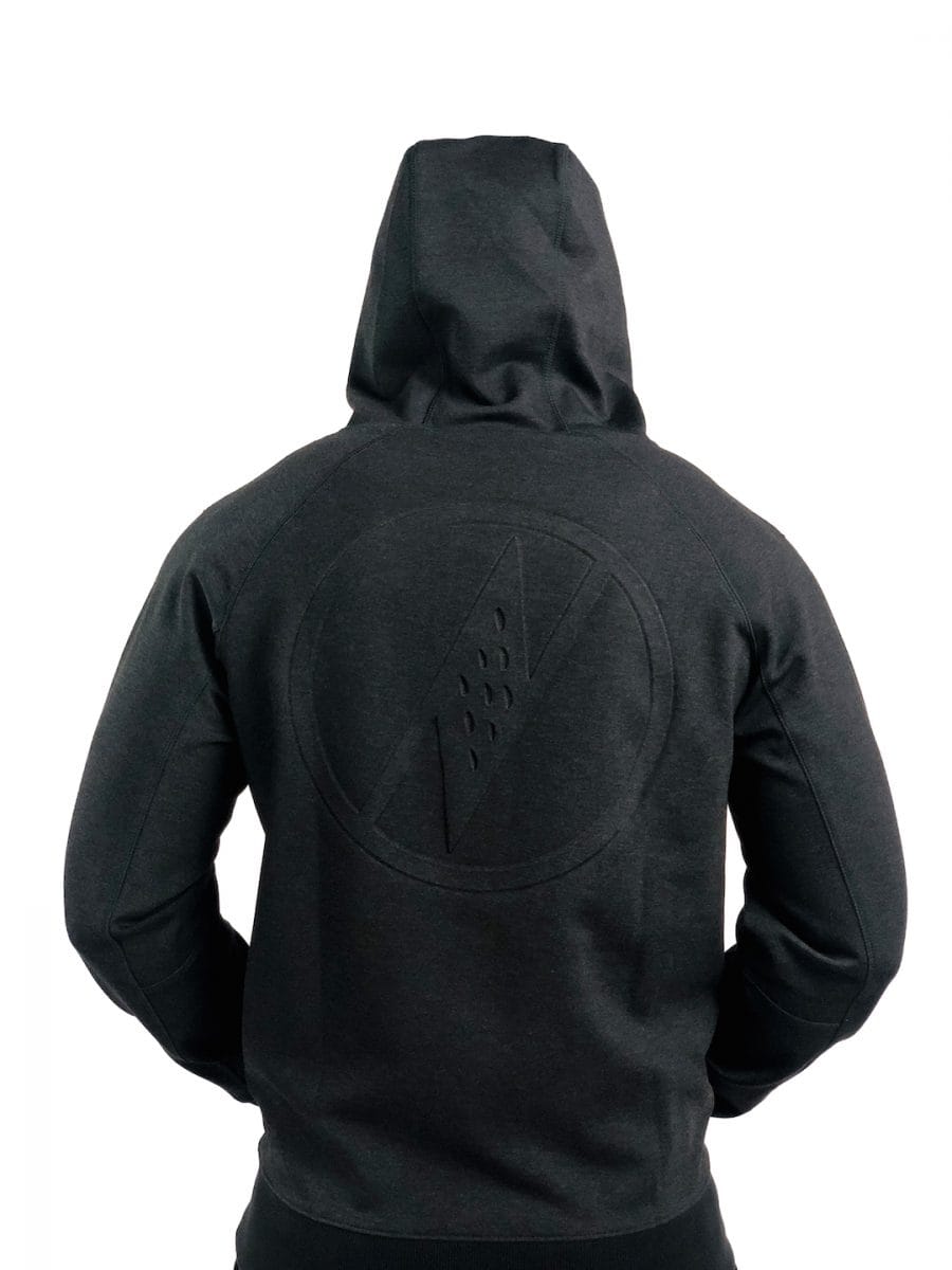 Male model wearing a Uwila Logo Jacket in Black - Back View