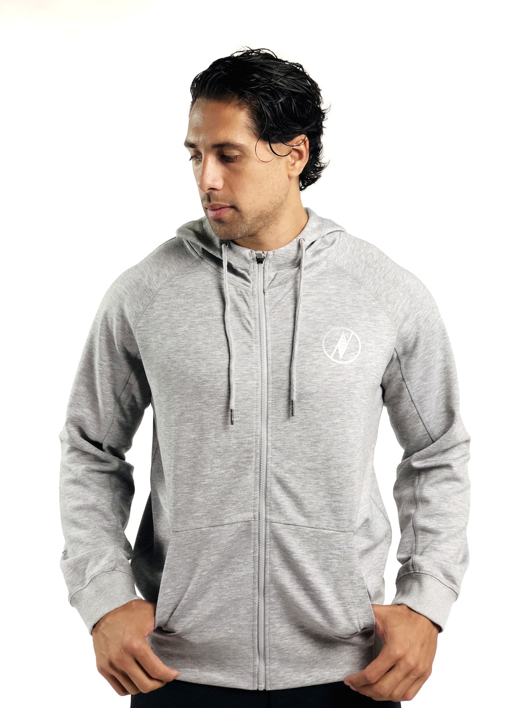 Male model wearing a Uwila Logo Jacket in Grey - Front View