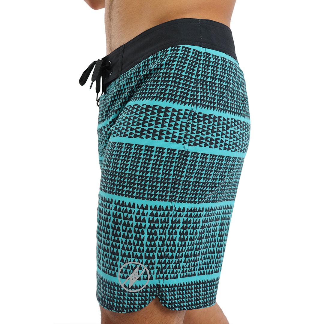 Male model wearing Boardshorts in Akoakoa Pattern and Blue - Side View