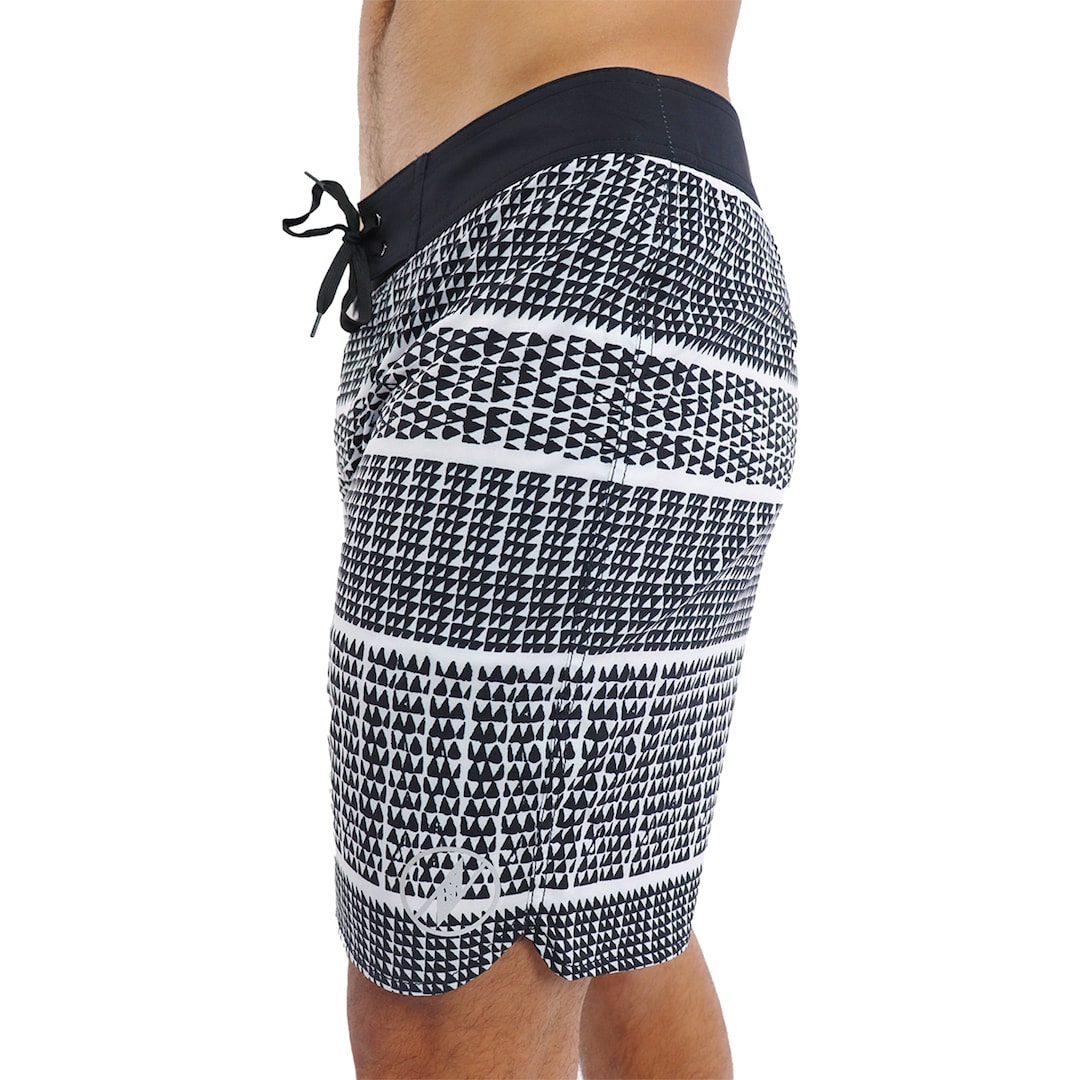 Male model wearing Boardshorts in Akoakoa Pattern and White - Side View