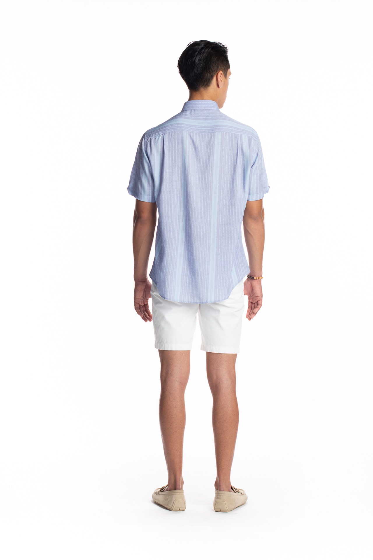 Male model wearing Aloha Shirt in Hoonionio Pattern - Back View