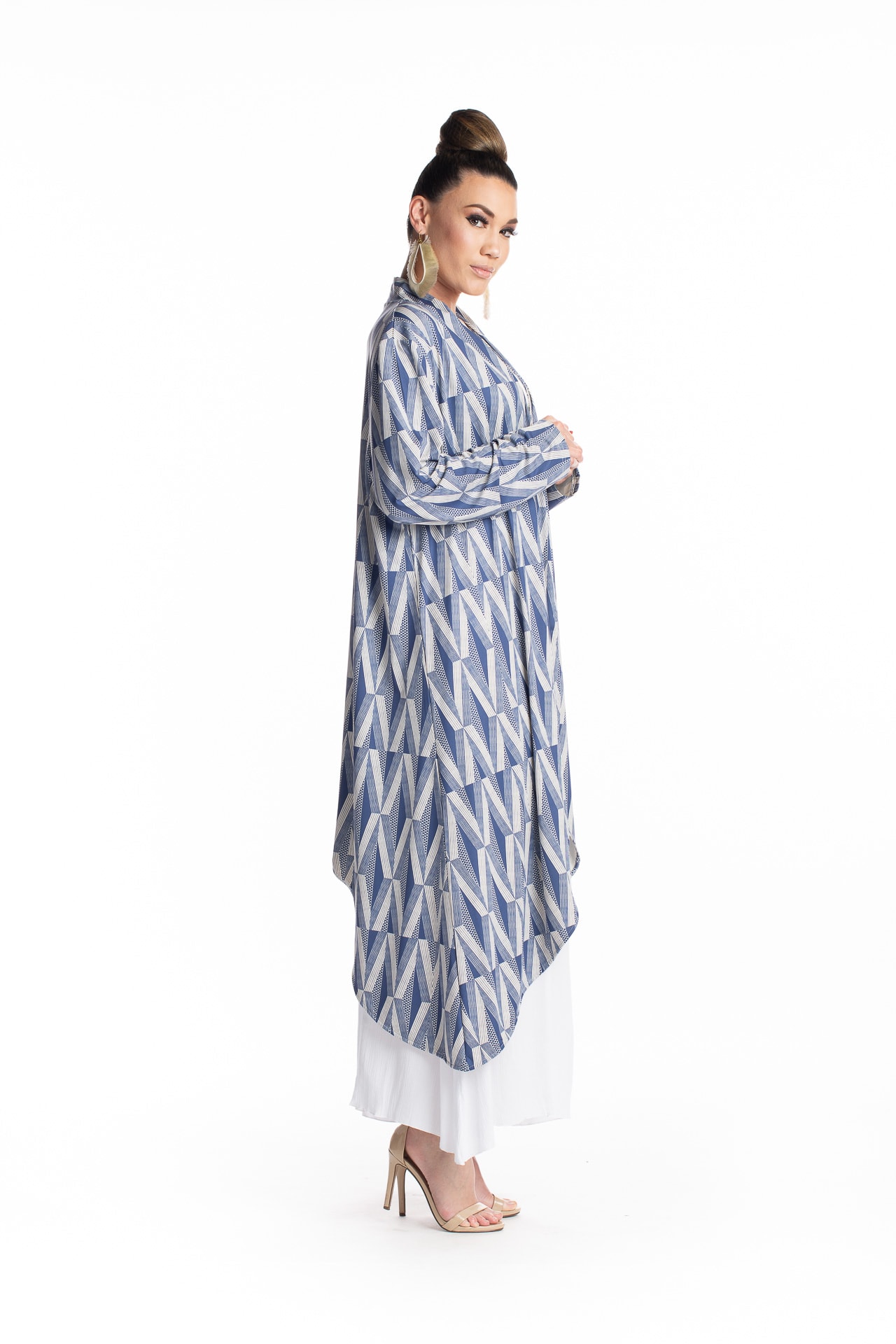 Female model wearing a Waiolu Cardign in Indigo Moon - Side View