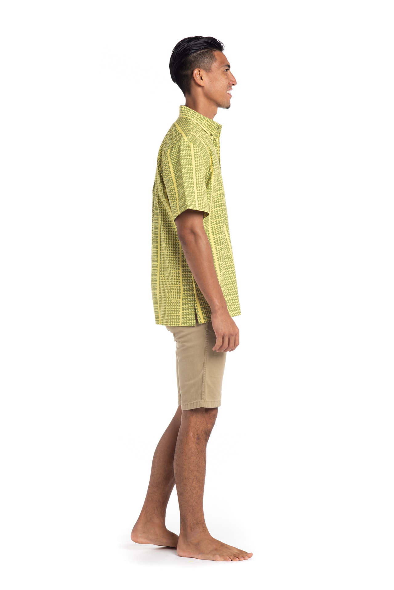 Male model wearing Mahalo Nui Shirt in Green Niho Ku - Side View
