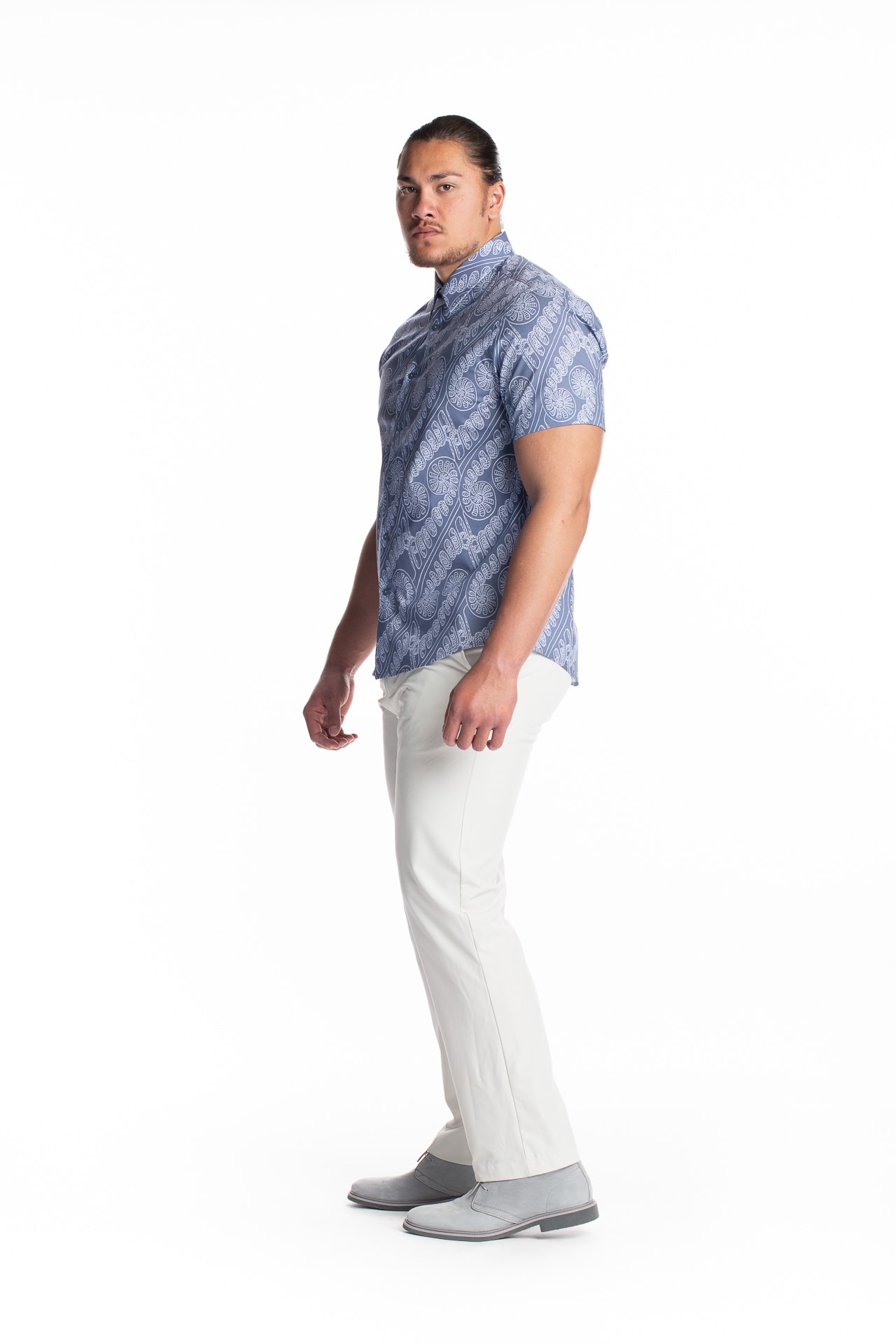 Male model wearing Aloha Short Sleeve in Amau Blue - side view