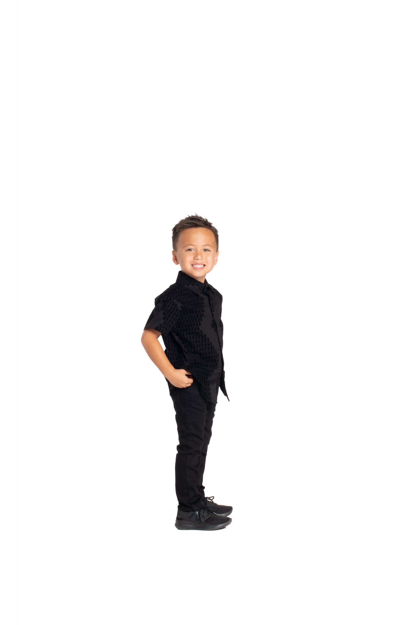 Boy wearing Keiki Aloha Short Sleeve in Black Niho Mano - Side View