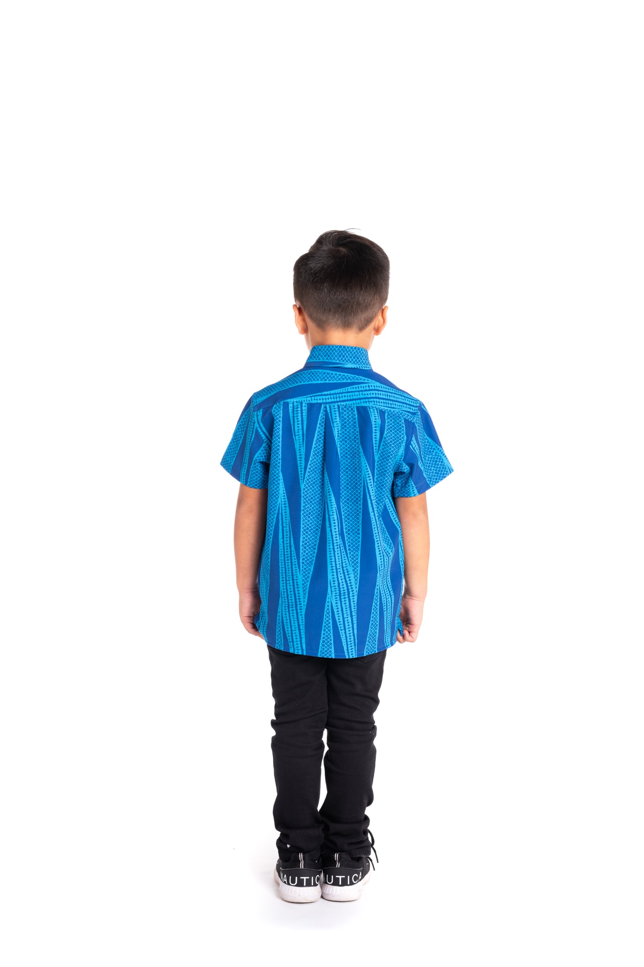 Boy wearing Keiki Mahalo Shirt S-S in Kialoa Blue - Back View