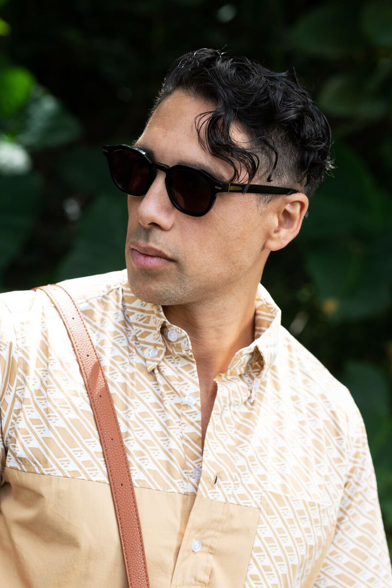 Male model wearing Hegias Black Sunglasses